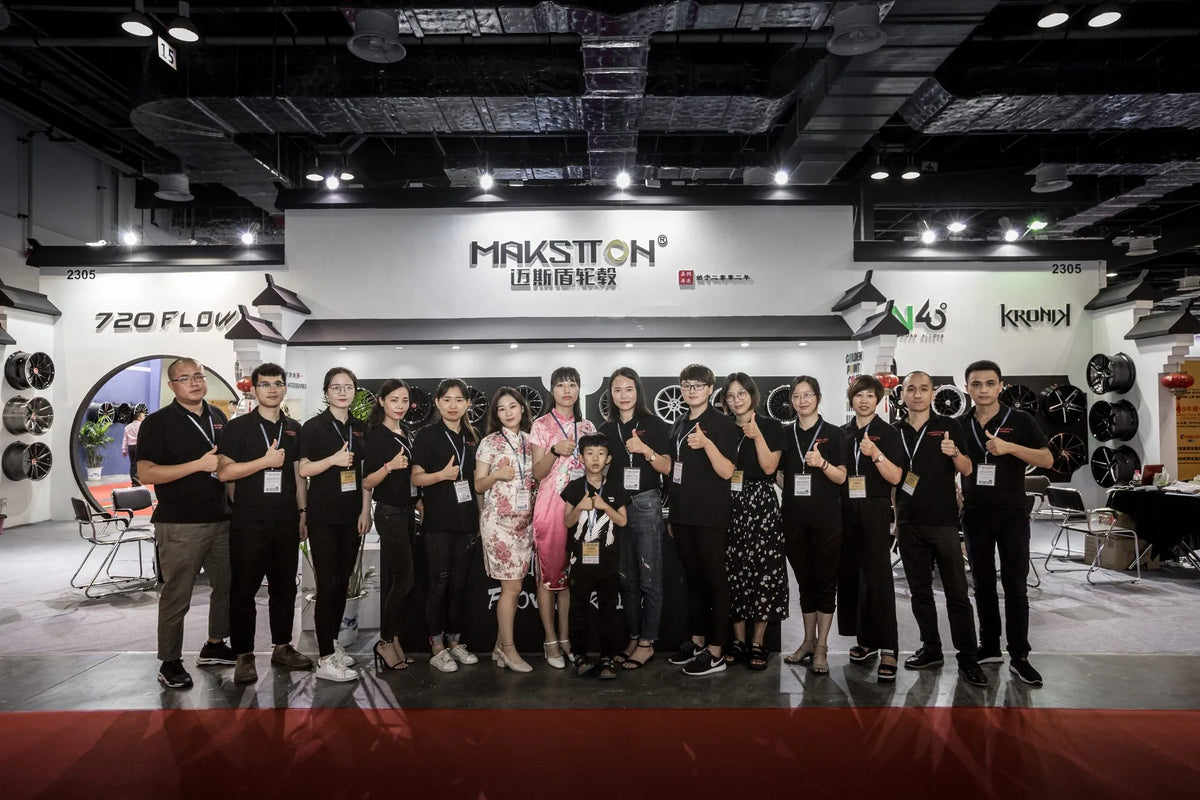 MAKSTTON team group in front of the exhibition wheel display — CITEXPO SHOW, Shanghai, China, 2018
