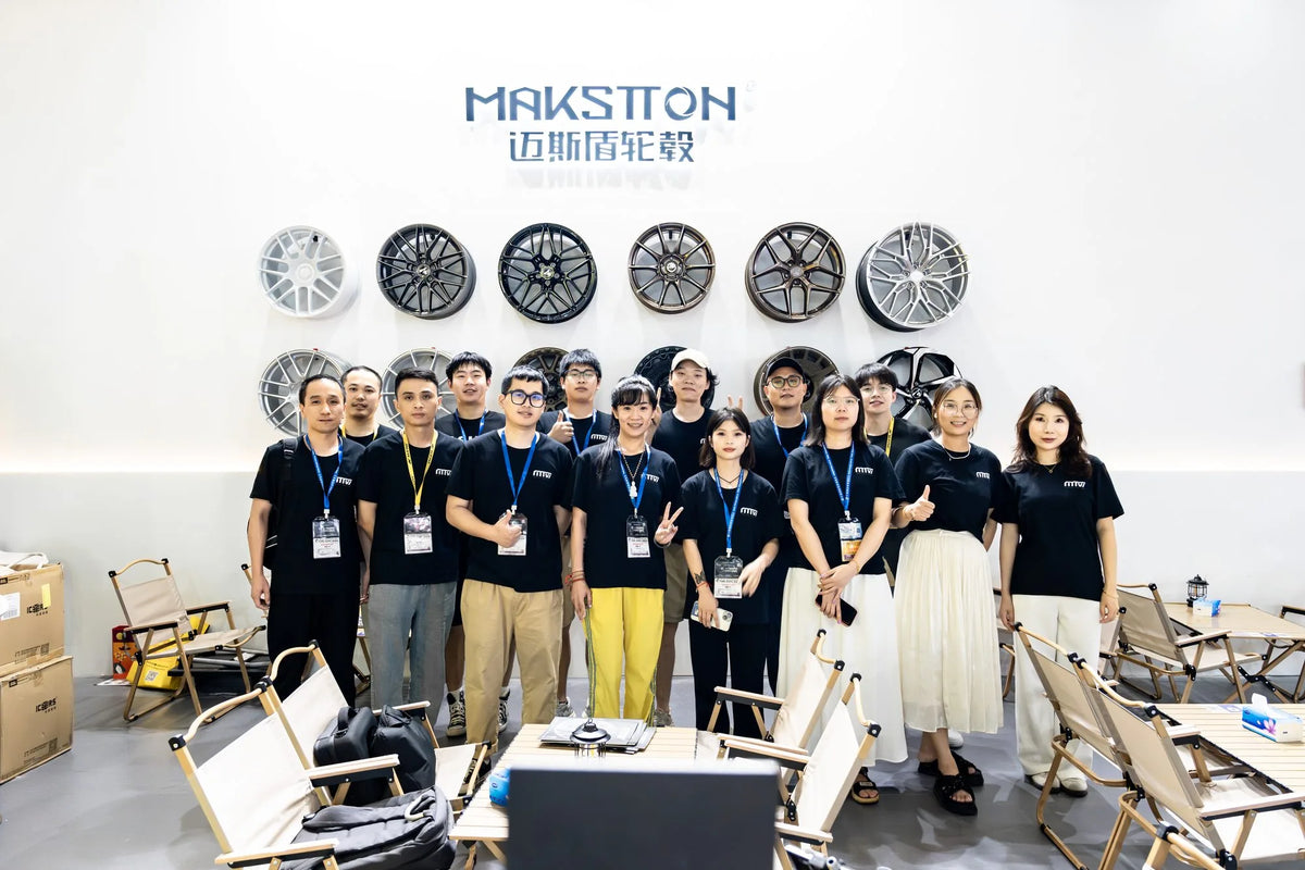 MAKSTTON team gathered in front of the wheel display — CITEXPO SHOW, Shanghai, China, 2024