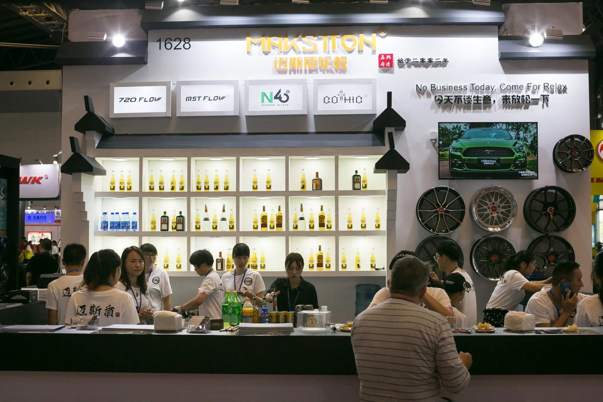 Visitors talking at the bar inside the MAKSTTON exhibition stand — CITEXPO SHOW, Shanghai, China, 2019