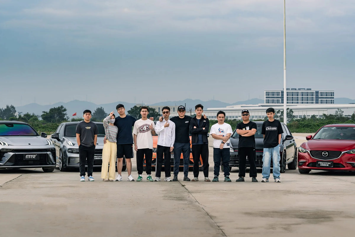 MAKSTTON owners gathered between their cars in an open parking area — Zhuhai, Guangdong, China, 2023