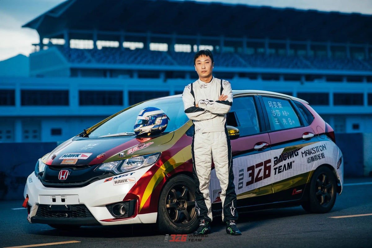 Driver standing beside the 326 Team race car at the circuit — 326 Team · CEC, China, 2021